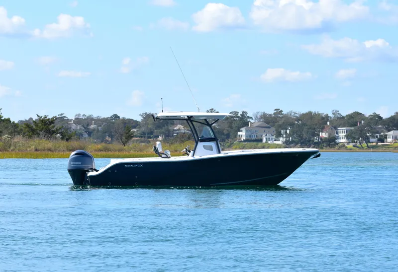 Slide: The Image of 2020 Sea Fox 266 Commander boat cruising on a calm lake under a blue sky. - 4