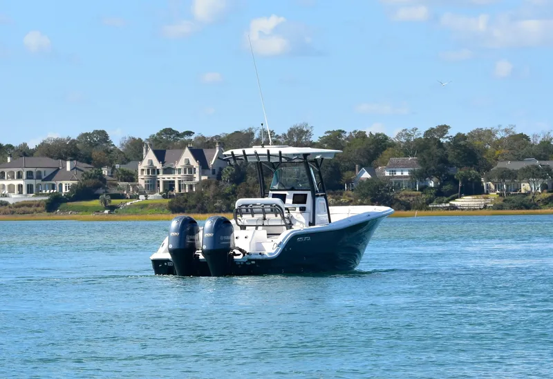 Slide: The Image of 2020 Sea Fox 266 Commander boat on calm water near shoreline homes. - 5