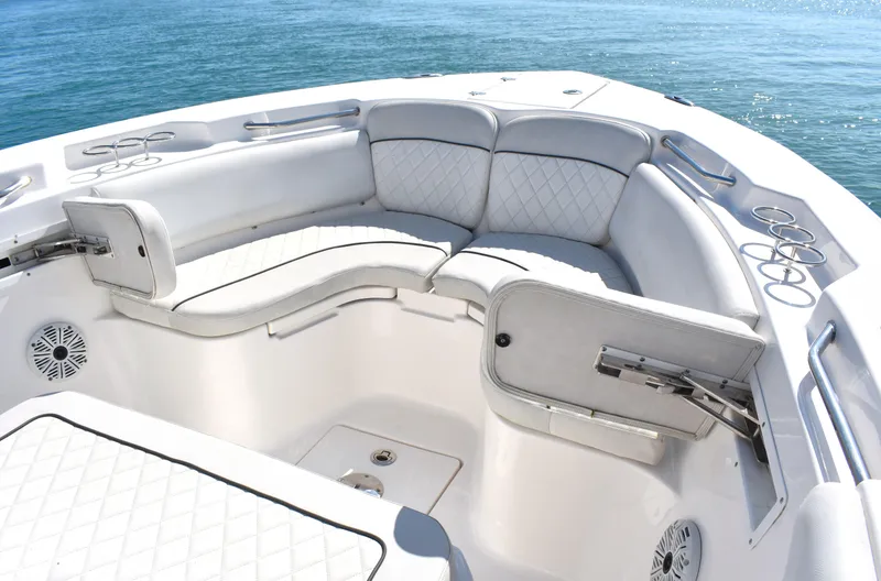 Slide: The Image of 2020 Sea Fox 266 Commander boat interior with cushioned seating and cup holders. - 7