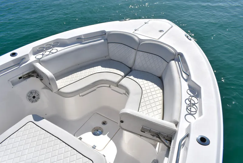 Slide: The Image of 2020 Sea Fox 266 Commander boat interior with cushioned seating and cup holders. - 8