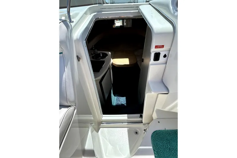Slide: The Image of 1995 Sea Ray 250 Sundancer cabin entrance with interior view. - 25