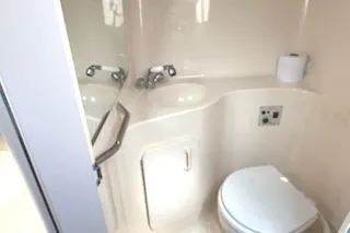 Slide: The Image of 1995 Sea Ray 250 Sundancer boat bathroom with sink and toilet. - 9