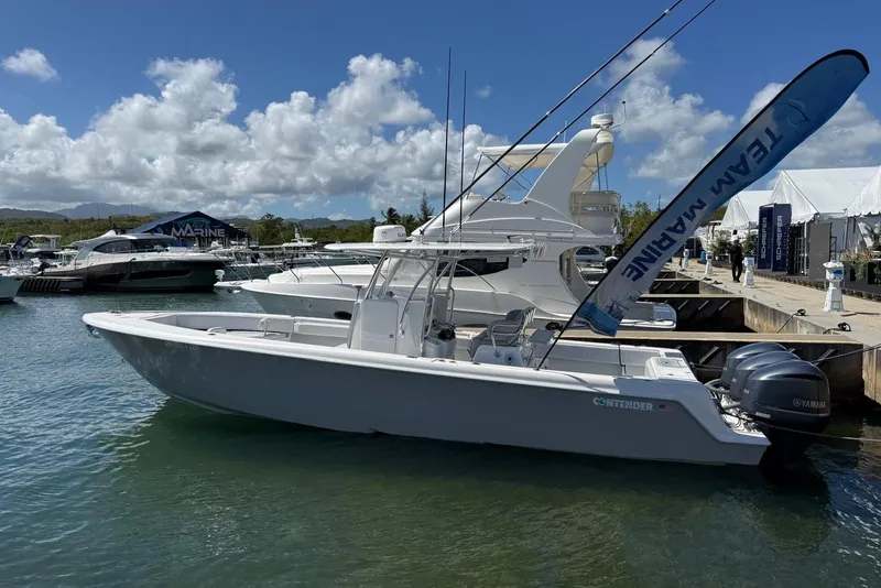 The Image of 2020 Contender 35 ST boat docked at marina with Yamaha engines. - 0