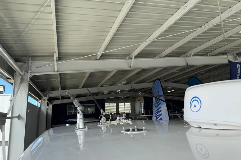 Slide: The Image of 2020 Contender 35 ST boat under metal roof with antennas and equipment. - 16