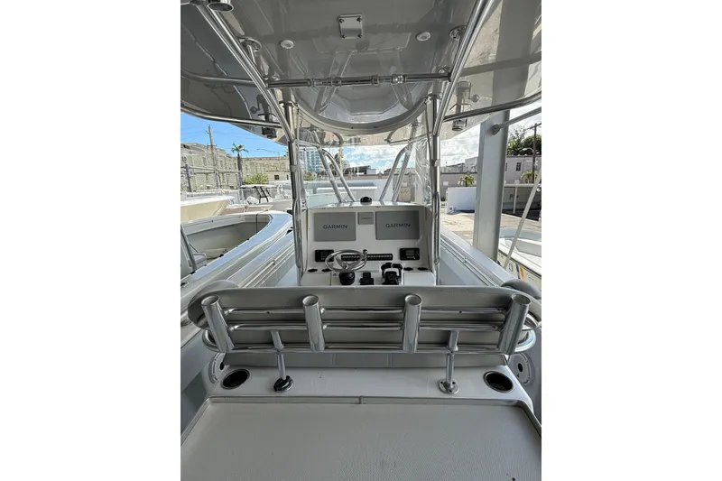 Slide: The Image of 2020 Contender 35 ST boat cockpit with Garmin navigation system and seating. - 17