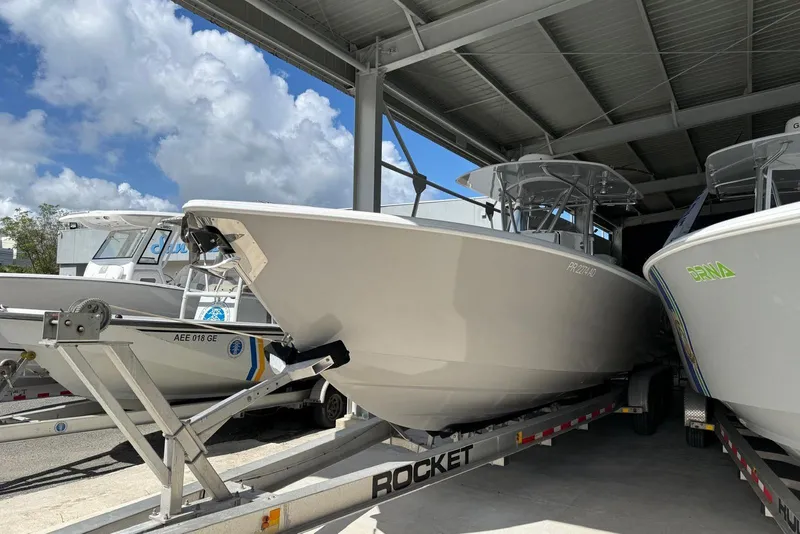Slide: The Image of 2020 Contender 35 ST boat on trailer under shelter, clear sky background. - 4