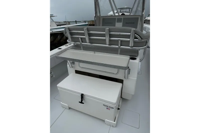 Slide: The Image of 2020 Contender 35 ST boat interior with Garmin electronics and storage compartment. - 6