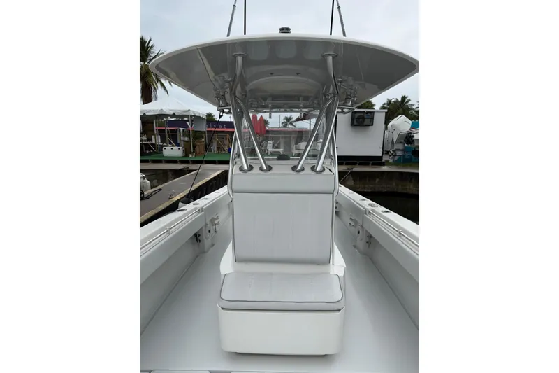 Slide: The Image of 2020 Contender 35 ST boat with center console and seating, docked at marina. - 9