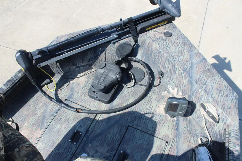 Slide: The Image of 2014 Lowe Roughneck 1756 boat deck with trolling motor and fish finder. - 17