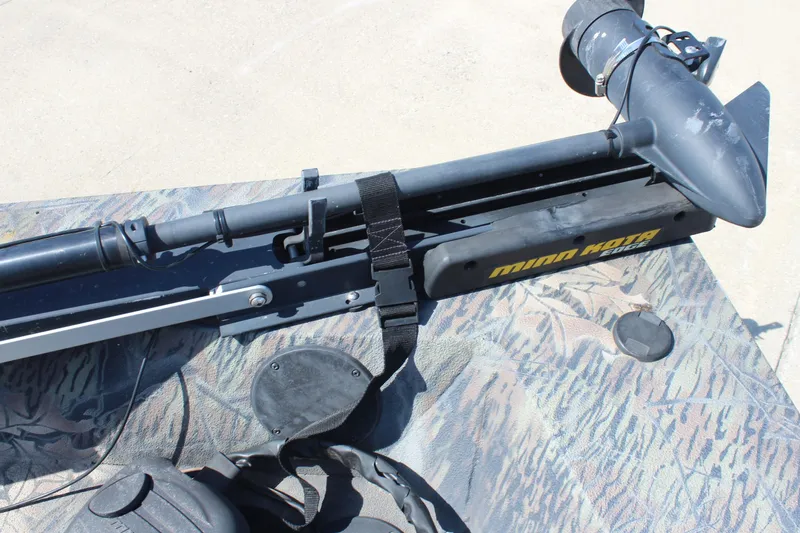 Slide: The Image of 2014 Lowe Roughneck 1756 boat with Minn Kota Edge trolling motor on camouflage deck. - 18