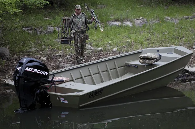 Slide: The Image of Manufacturer Provided Image: 2014 Lowe Roughneck 1756 boat with Mercury outboard motor, hunter in camouflage nearby. - 23