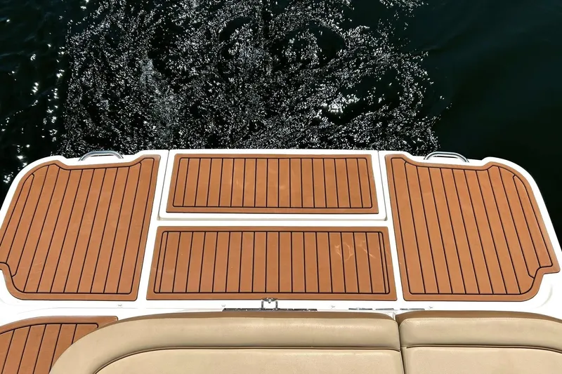 Slide: The Image of 2015 Sea Ray 270 Sundeck swim platform with teak-style decking on water. - 26