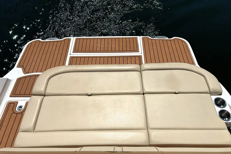 Slide: The Image of 2015 Sea Ray 270 Sundeck swim platform with cushioned seating and teak-style flooring. - 3