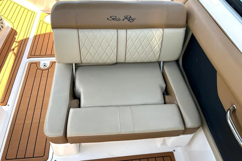 Slide: The Image of 2015 Sea Ray 270 Sundeck boat seat with tan and cream upholstery. - 36