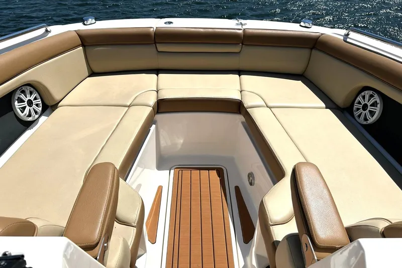 Slide: The Image of Luxurious seating area on a 2015 Sea Ray 270 Sundeck boat, with tan upholstery. - 4