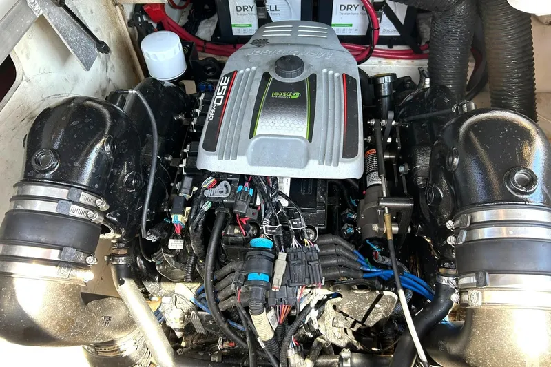 Slide: The Image of Engine compartment of a 2015 Sea Ray 270 Sundeck boat, featuring a 350 MAG engine. - 50