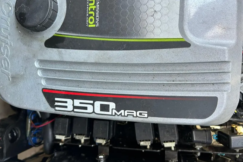 Slide: The Image of Close-up of a 2015 Sea Ray 270 Sundeck 350 MAG engine cover. - 52