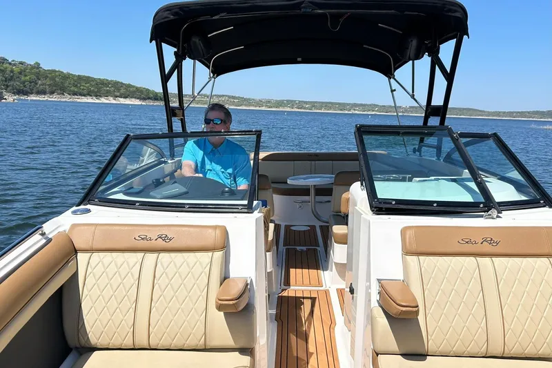 Slide: The Image of 2015 Sea Ray 270 Sundeck on water, featuring luxurious seating and sleek design. - 53