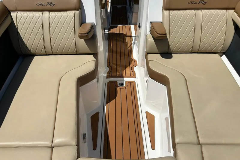 Slide: The Image of 2015 Sea Ray 270 Sundeck interior with beige leather seating and teak flooring. - 54