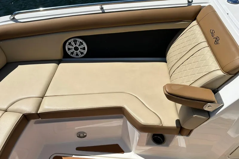 Slide: The Image of Luxurious seating on a 2015 Sea Ray 270 Sundeck boat with tan upholstery. - 55