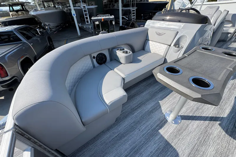 Slide: The Image of Luxurious seating on 2026 Bennington 22 LFB pontoon boat with cup holders and table. - 18