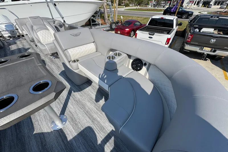 Slide: The Image of Luxurious seating on a 2026 Bennington 22 LFB pontoon boat, featuring cup holders and elegant upholstery. - 19