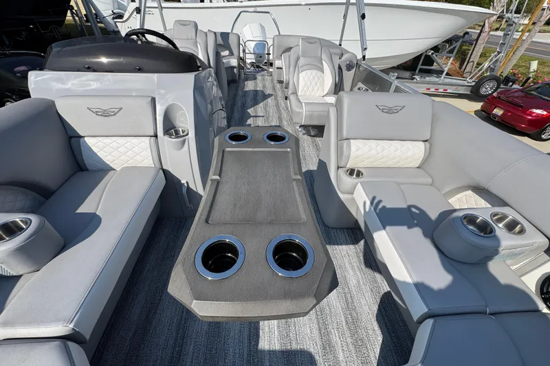 Slide: The Image of Luxurious interior of 2026 Bennington 22 LFB pontoon boat with plush seating and cup holders. - 20