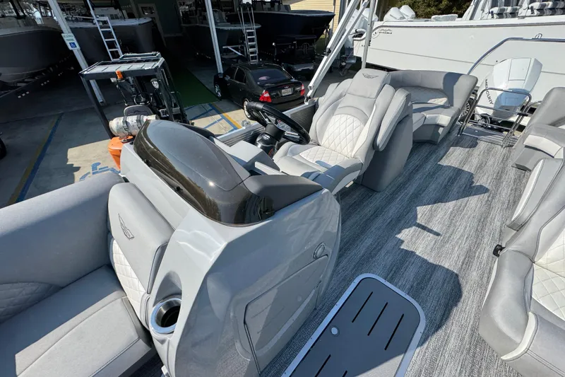 Slide: The Image of Interior view of a 2026 Bennington 22 LFB boat with luxurious seating and modern design. - 21