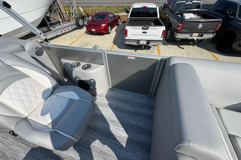 Slide: The Image of Interior of 2026 Bennington 22 LFB pontoon boat with gray seating and cup holders. - 23