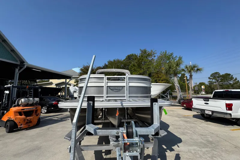 Slide: The Image of 2026 Bennington 22 LFB pontoon boat on trailer in sunny outdoor setting. - 5