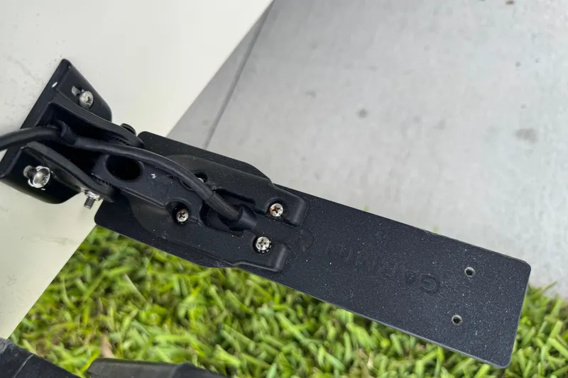 Slide: The Image of Close-up of a 2024 Key West 263 FS boat component with wiring and screws. - 10