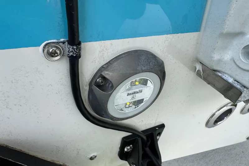 Slide: The Image of Close-up of 2024 Key West 263 FS boat's SeaBlaze underwater light installation. - 11