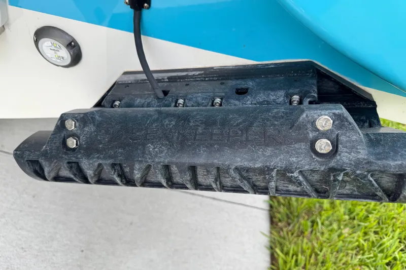 Slide: The Image of Close-up of 2024 Key West 263 FS boat component with blue and white detailing. - 13