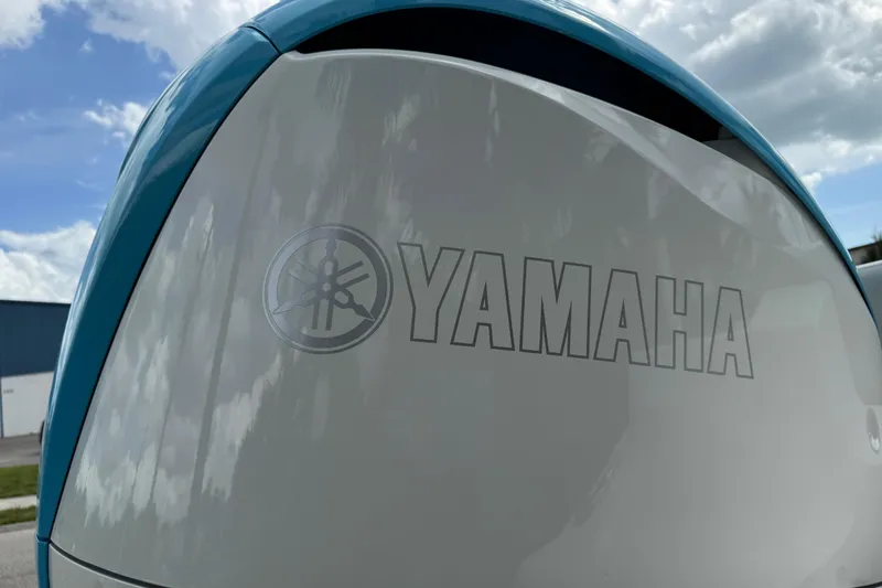 Slide: The Image of Close-up of Yamaha logo on 2024 Key West 263 FS boat engine. - 16