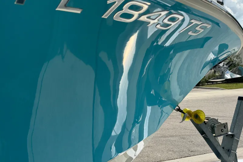 Slide: The Image of 2024 Key West 263 FS boat with blue hull and registration number 1849 TS. - 29