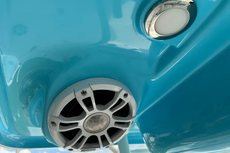 Slide: The Image of Close-up of 2024 Key West 263 FS boat speaker and light on blue surface. - 33