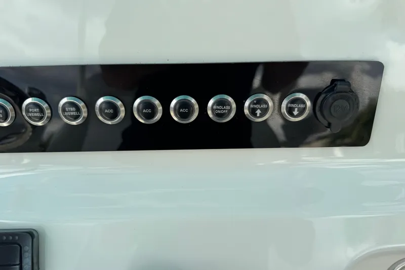 Slide: The Image of Control panel of 2024 Key West 263 FS boat with various function buttons. - 39