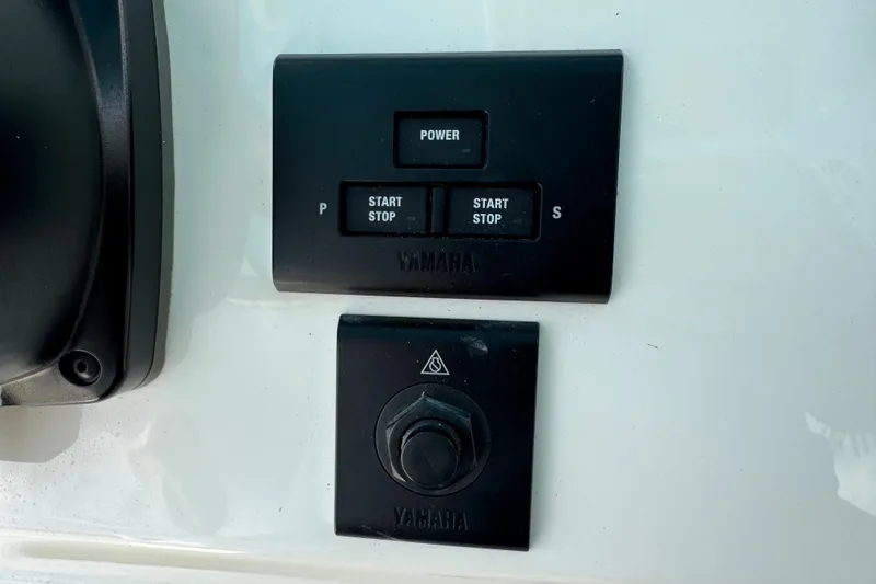 Slide: The Image of Control panel of a 2024 Key West 263 FS boat with Yamaha start-stop buttons. - 41