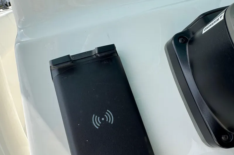 Slide: The Image of Wireless charging pad on 2024 Key West 263 FS boat dashboard. - 45