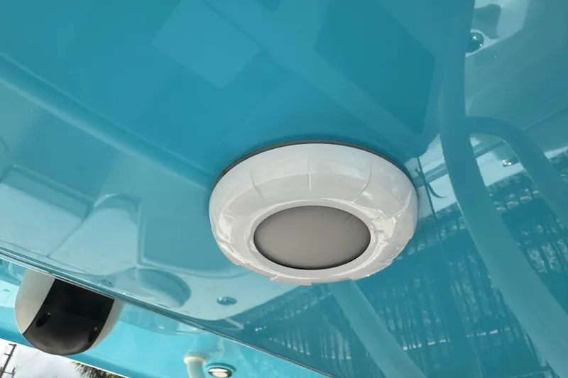 Slide: The Image of 2024 Key West 263 FS boat detail, featuring a white circular fixture on a blue surface. - 46