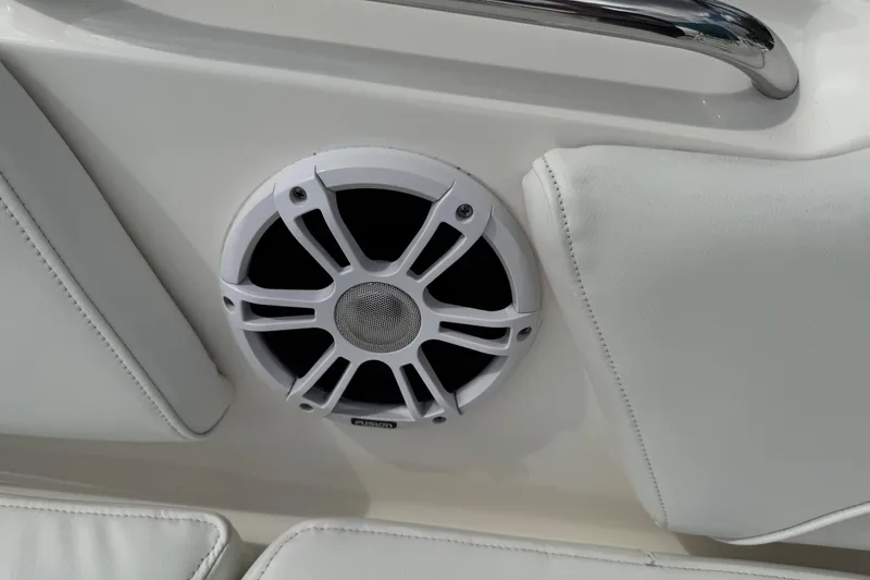 Slide: The Image of 2024 Key West 263 FS boat speaker with white cushioned seating. - 57