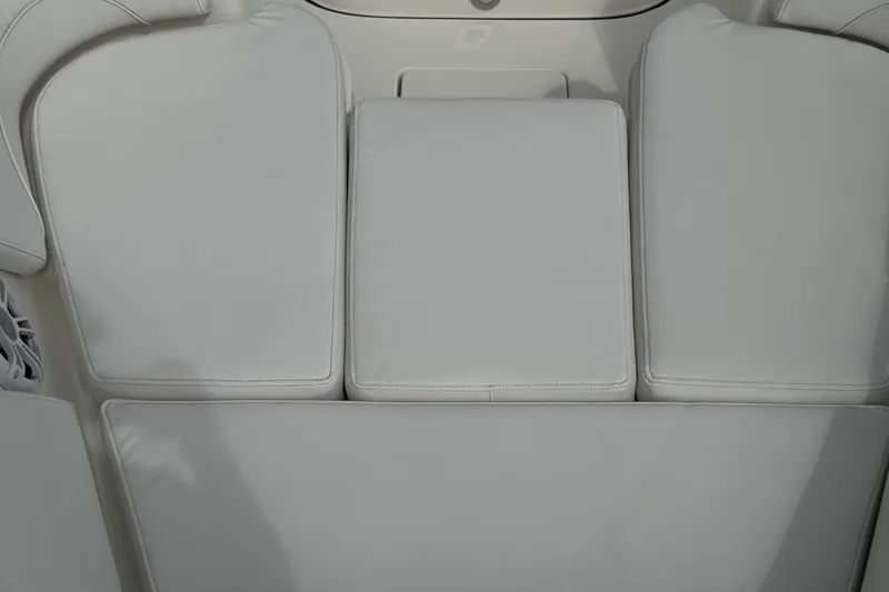 Slide: The Image of 2024 Key West 263 FS boat seating with white cushioned upholstery. - 60