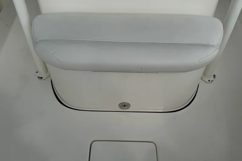 Slide: The Image of 2024 Key West 263 FS boat seat and deck detail, featuring white upholstery. - 70