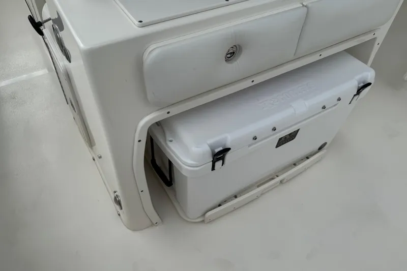 Slide: The Image of 2024 Key West 263 FS boat interior with built-in cooler storage. - 86