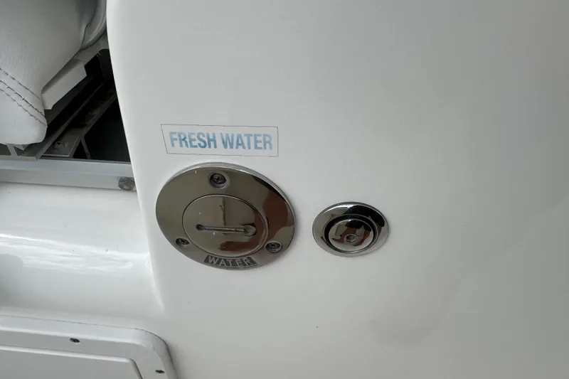 Slide: The Image of 2024 Key West 263 FS boat fresh water access panel. - 87
