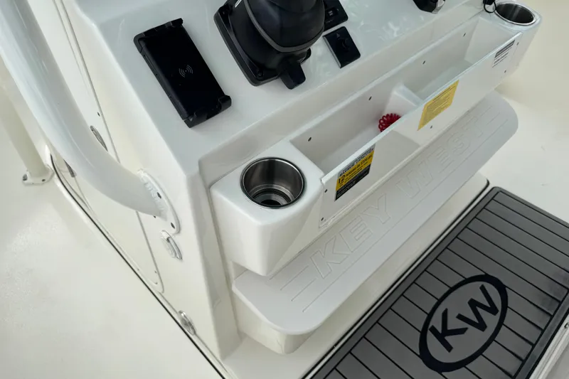 Slide: The Image of 2024 Key West 263 FS boat console with cup holders and storage compartments. - 88