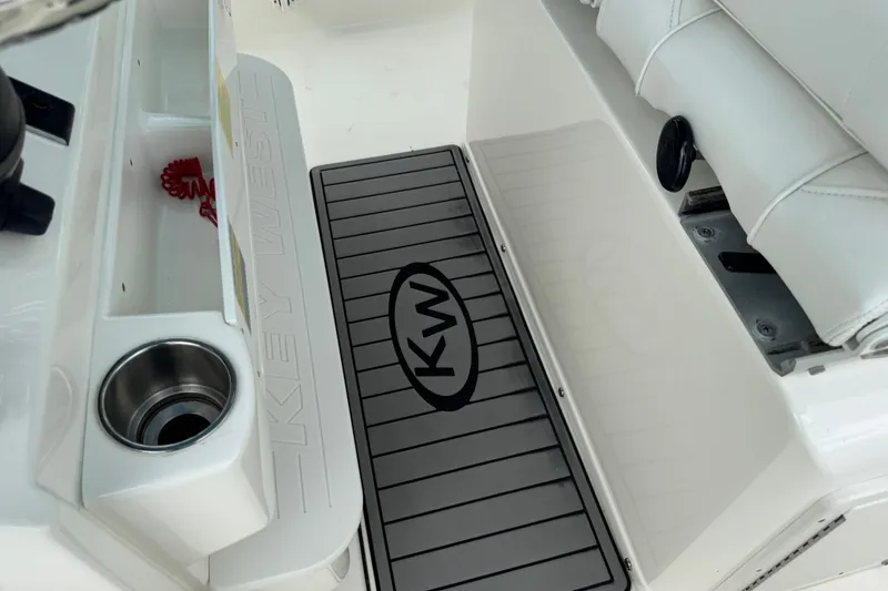 Slide: The Image of 2024 Key West 263 FS boat interior with branded flooring and seating. - 89