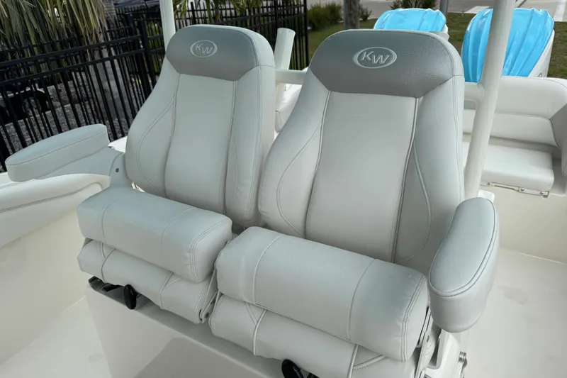 Slide: The Image of 2024 Key West 263 FS boat seats with armrests, featuring sleek gray upholstery. - 90