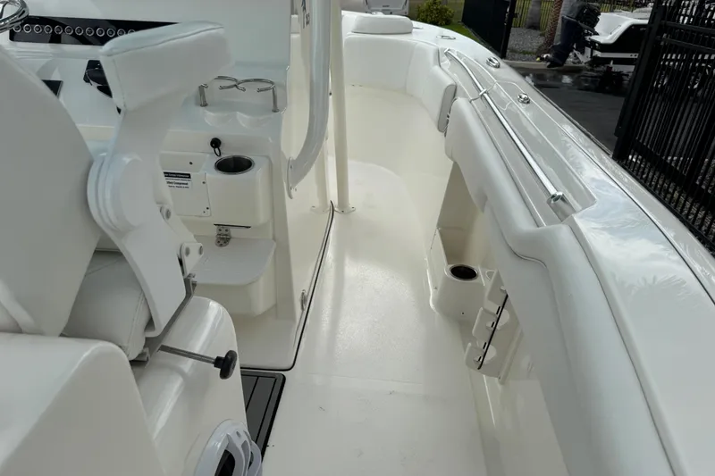Slide: The Image of 2024 Key West 263 FS boat interior with seating and cup holders. - 95