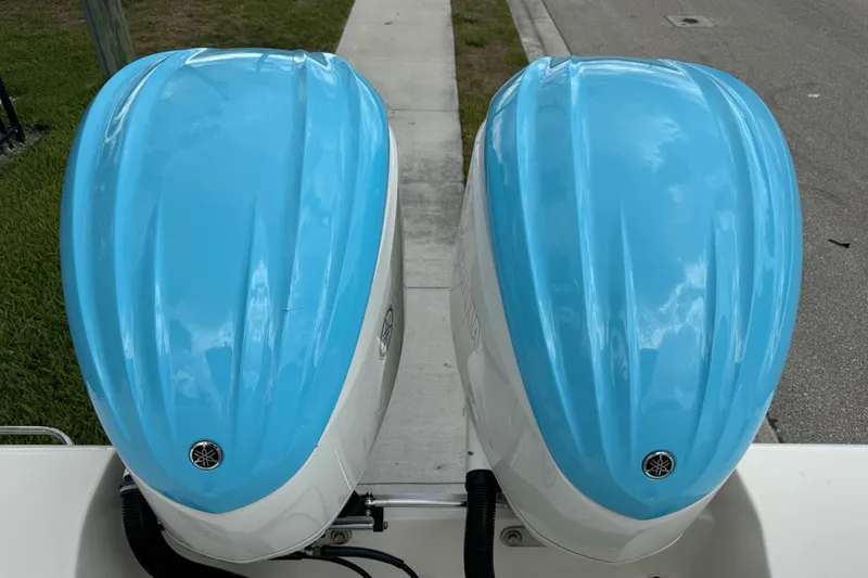 Slide: The Image of Twin blue Yamaha outboard motors on a 2024 Key West 263 FS boat. - 96